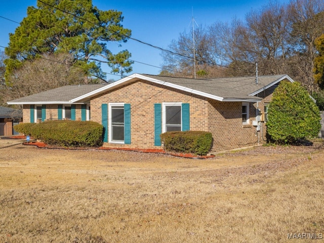 view of home's exterior with a lawn