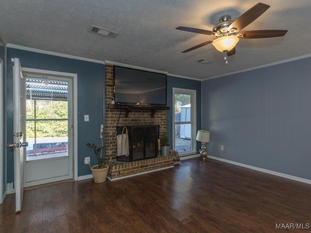 unfurnished living room with dark hardwood / wood-style floors, crown molding, and a textured ceiling