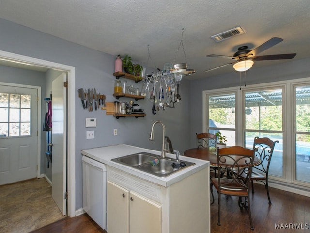 kitchen featuring kitchen peninsula, ceiling fan, white dishwasher, a textured ceiling, and sink