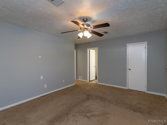 spare room with light carpet, ceiling fan, and a textured ceiling