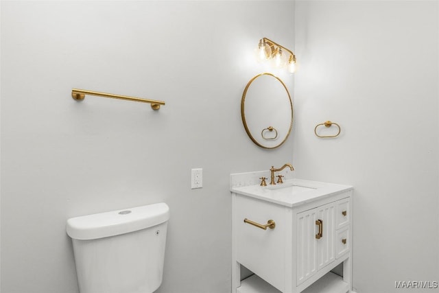 bathroom with toilet and vanity