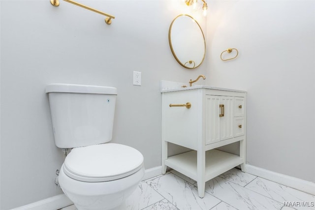 bathroom with toilet and vanity