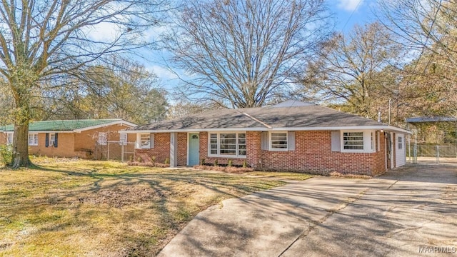 ranch-style home featuring a front yard