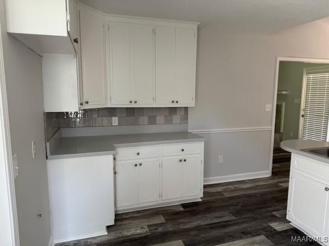 kitchen featuring sink, white cabinets, and dark hardwood / wood-style floors