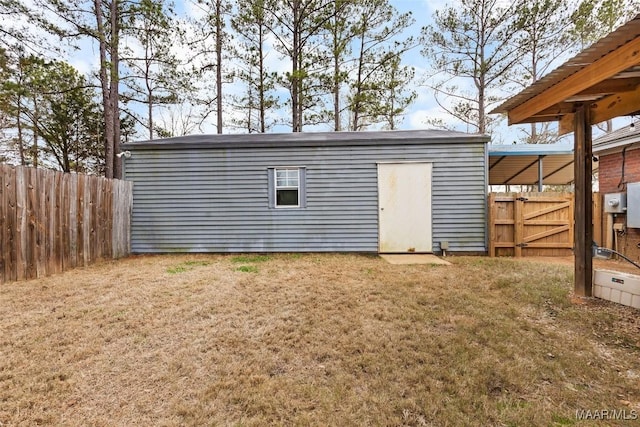 view of outbuilding featuring a lawn