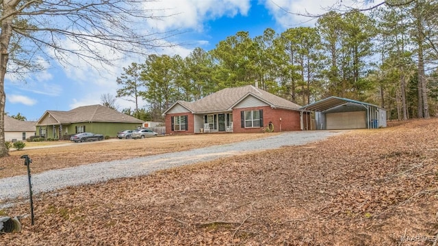 ranch-style home with a carport and a porch