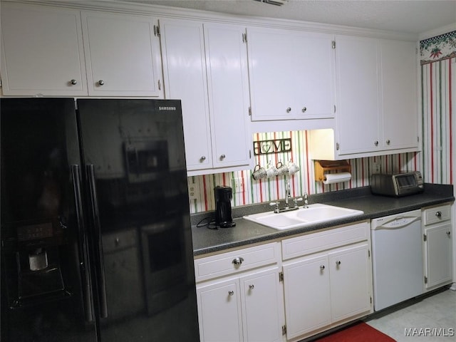 kitchen with black refrigerator with ice dispenser, sink, white cabinets, and dishwasher