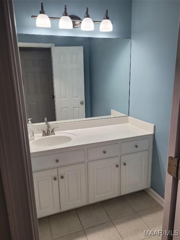 bathroom featuring vanity and tile patterned flooring