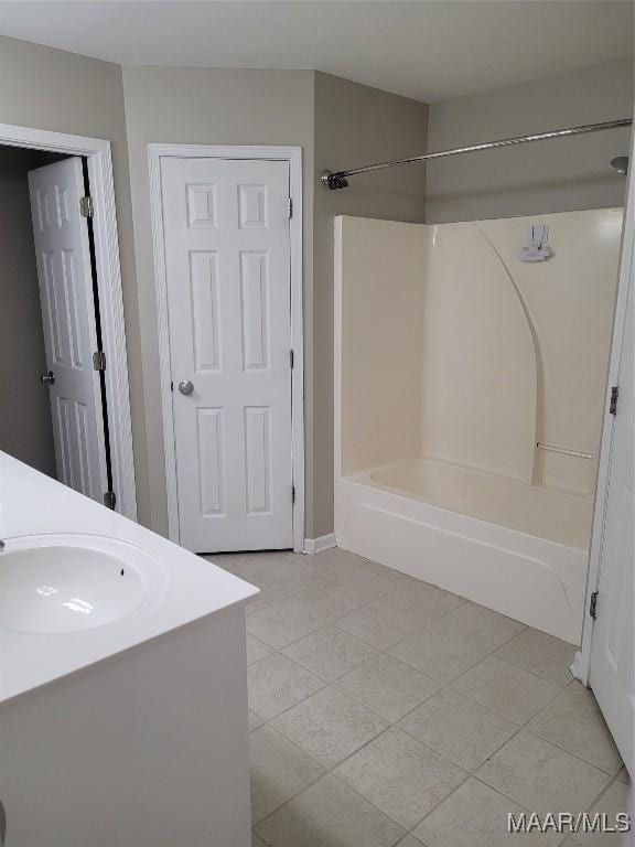 bathroom featuring shower / bath combination, tile patterned floors, and vanity