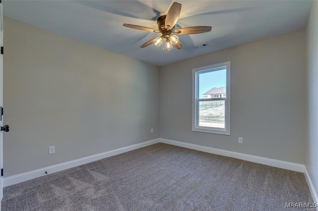 empty room featuring ceiling fan and carpet flooring