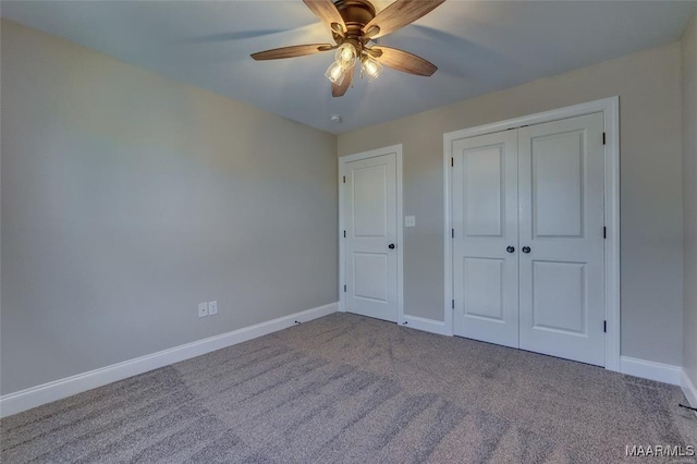 unfurnished bedroom with a closet, ceiling fan, and carpet