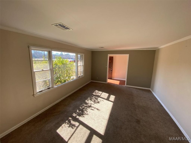 carpeted empty room featuring crown molding