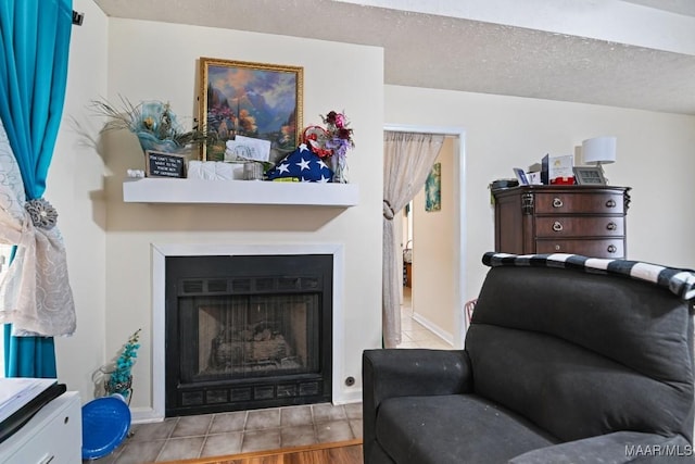 living room featuring a textured ceiling and light hardwood / wood-style floors