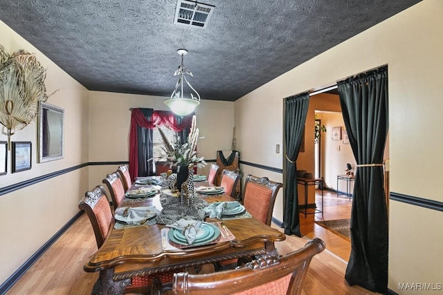 dining room featuring light hardwood / wood-style flooring