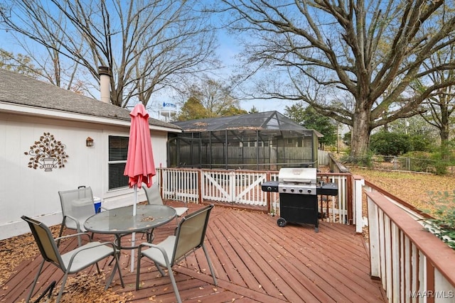 deck featuring a lanai and a grill