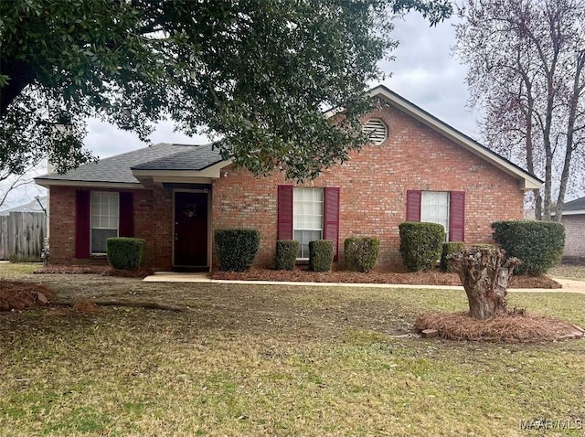 single story home featuring a front yard