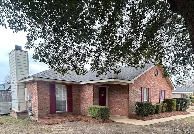 ranch-style home featuring cooling unit