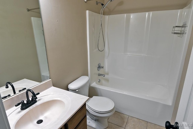 full bathroom with toilet, vanity, tile patterned flooring, and washtub / shower combination