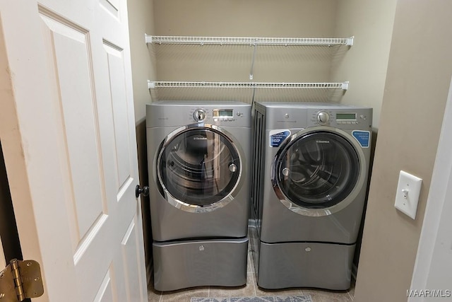 laundry area with washing machine and clothes dryer