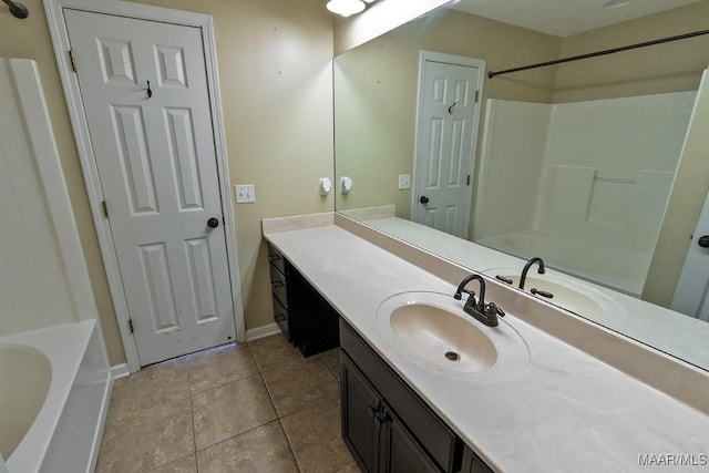 bathroom with shower / bath combination, vanity, and tile patterned flooring