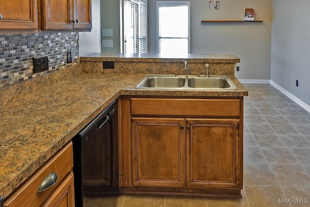 kitchen featuring dishwasher, tile patterned flooring, tasteful backsplash, sink, and kitchen peninsula