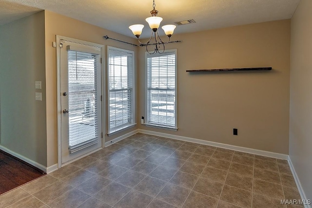 unfurnished dining area with an inviting chandelier