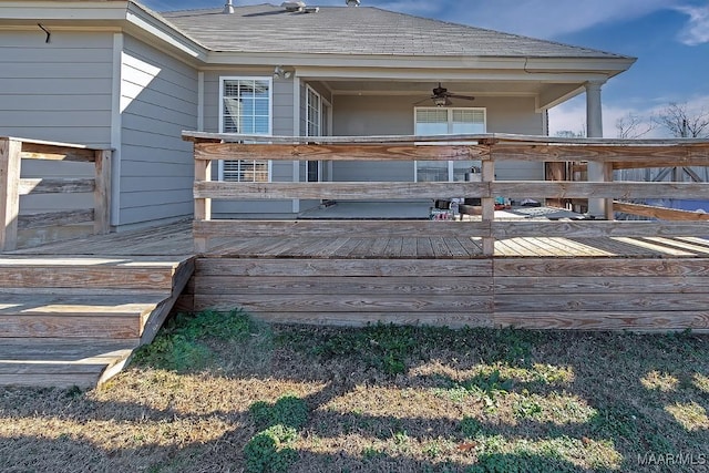 rear view of house with ceiling fan and a deck