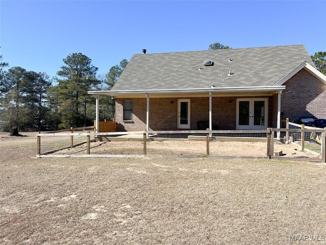 rear view of property featuring french doors