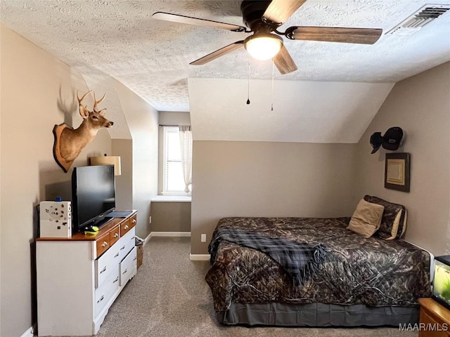 carpeted bedroom featuring ceiling fan, a textured ceiling, and lofted ceiling