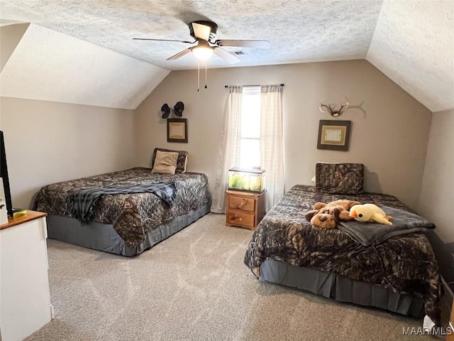 carpeted bedroom with ceiling fan, a textured ceiling, and lofted ceiling