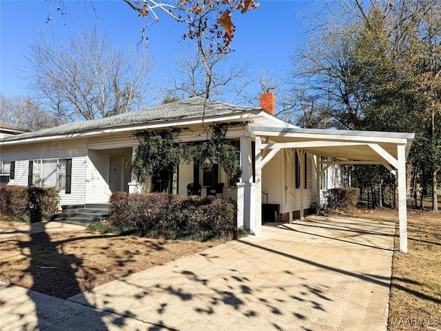 view of front of home featuring a carport