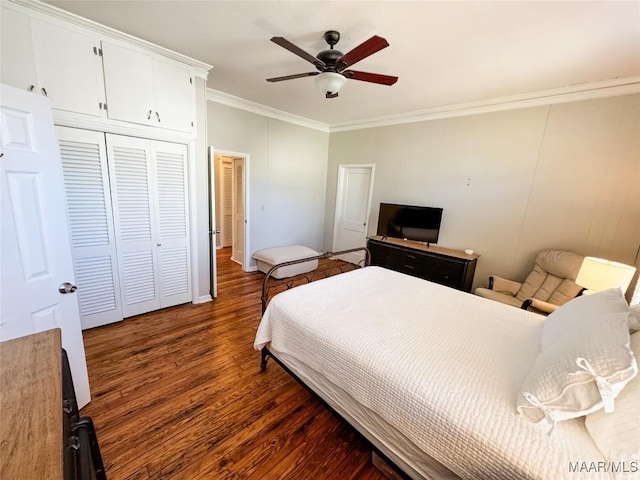 bedroom with ceiling fan, dark hardwood / wood-style flooring, and ornamental molding