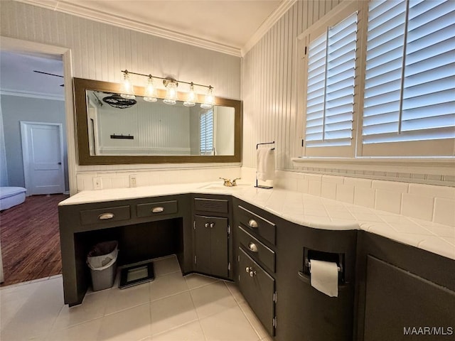 bathroom with vanity, tile patterned flooring, and ornamental molding