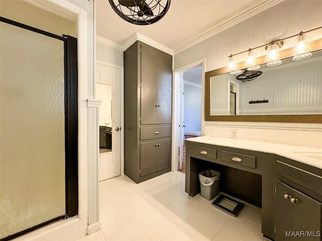 bathroom with ornamental molding, tile patterned floors, and vanity