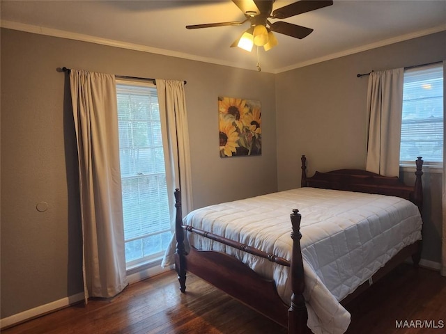 bedroom featuring ceiling fan, dark wood-type flooring, and ornamental molding