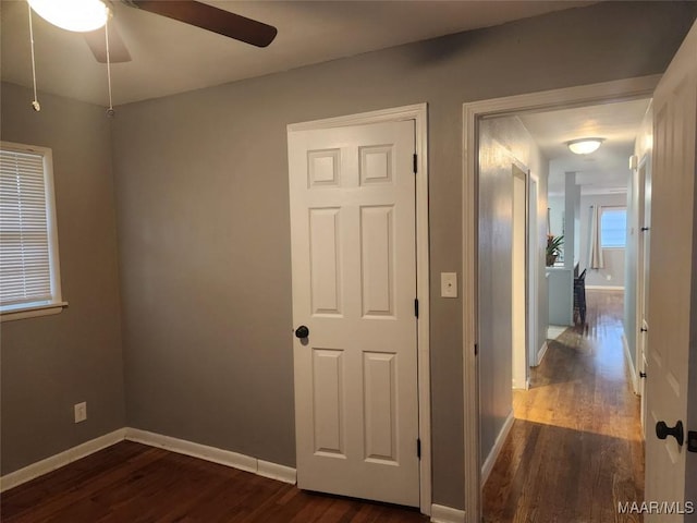 interior space featuring ceiling fan and dark hardwood / wood-style floors