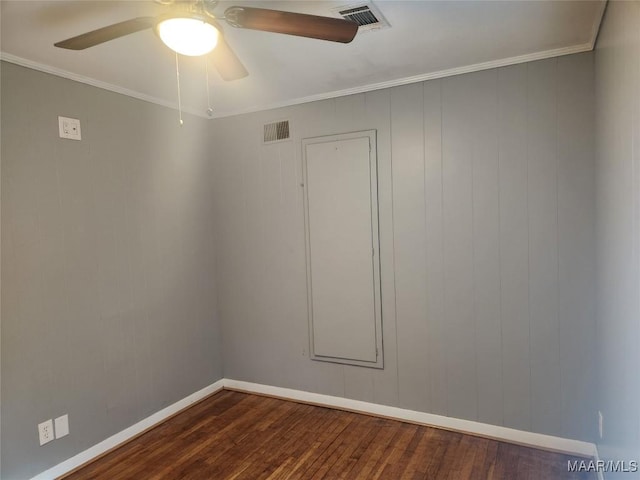 empty room with ceiling fan, crown molding, and dark hardwood / wood-style floors