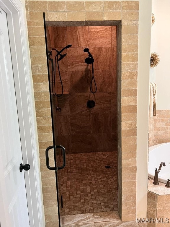 bathroom with independent shower and bath