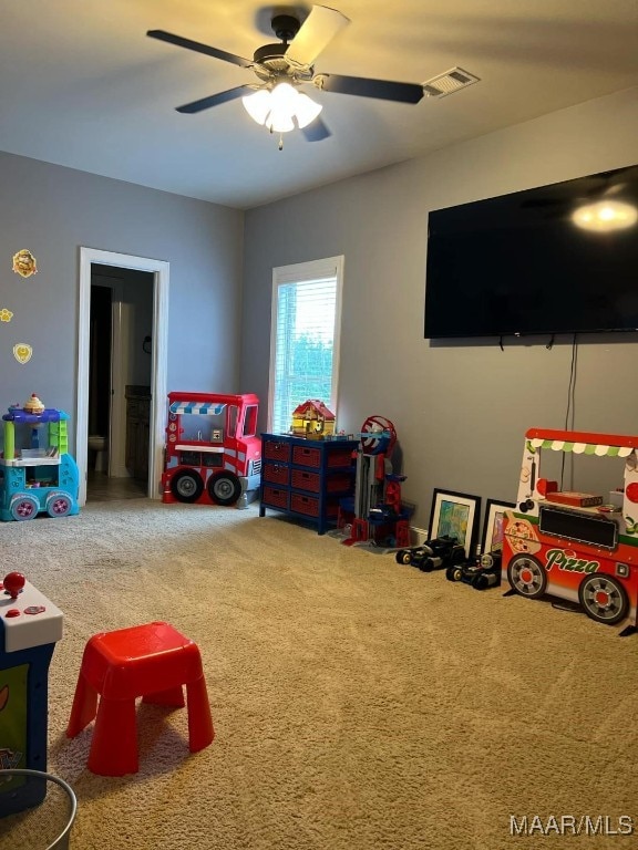 game room featuring carpet floors and ceiling fan