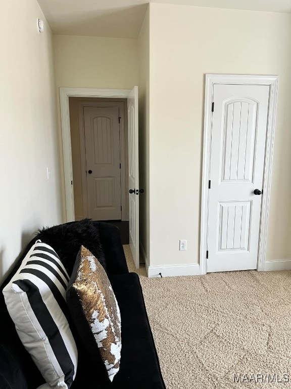 bedroom featuring light carpet