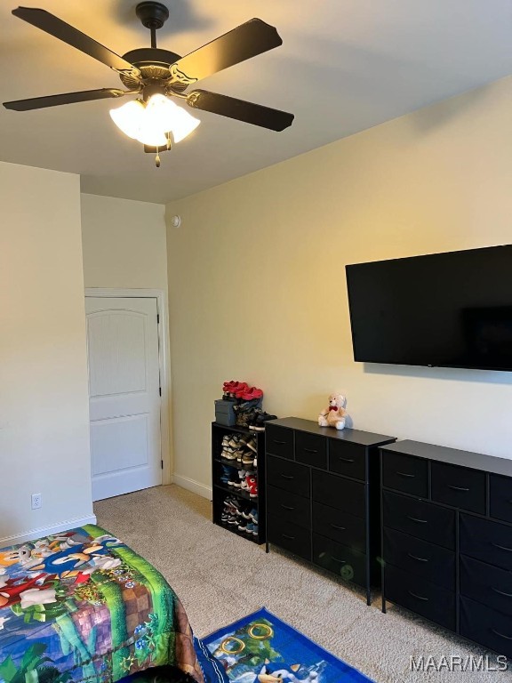 carpeted bedroom with ceiling fan