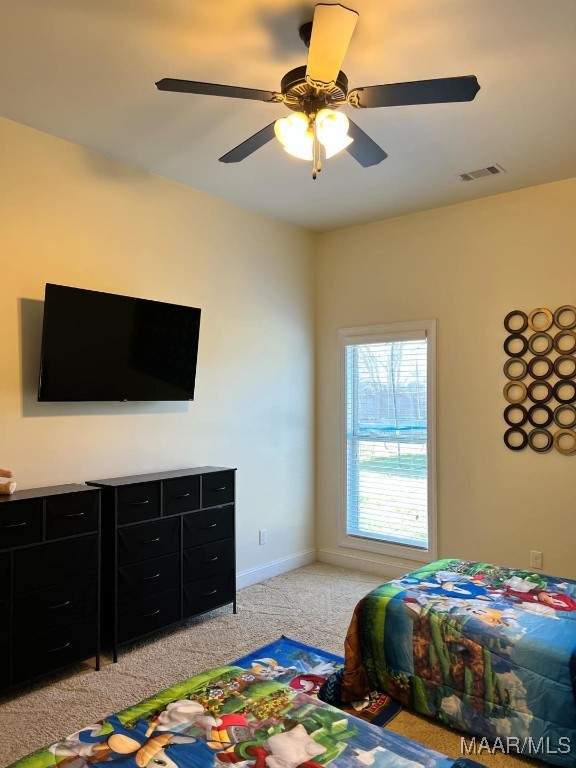 carpeted bedroom with ceiling fan