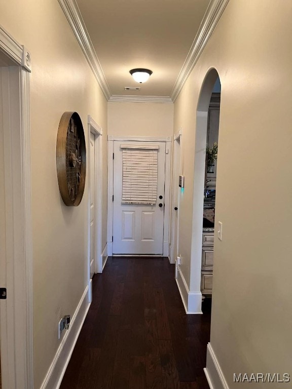 hallway featuring dark hardwood / wood-style flooring and ornamental molding