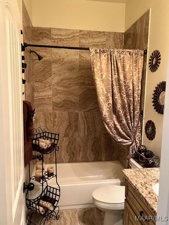 full bathroom with toilet, vanity, and shower / tub combo