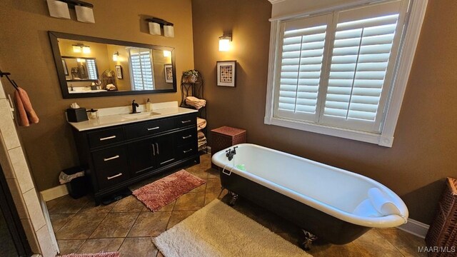 137 Scott Ln, Prattville, AL 36066 - full bathroom with a freestanding bath, vanity, and tile patterned floors
