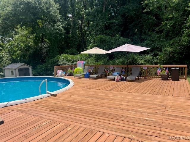 137 Scott Ln, Prattville, AL 36066 - swimming pool featuring a wooden deck and a storage shed
