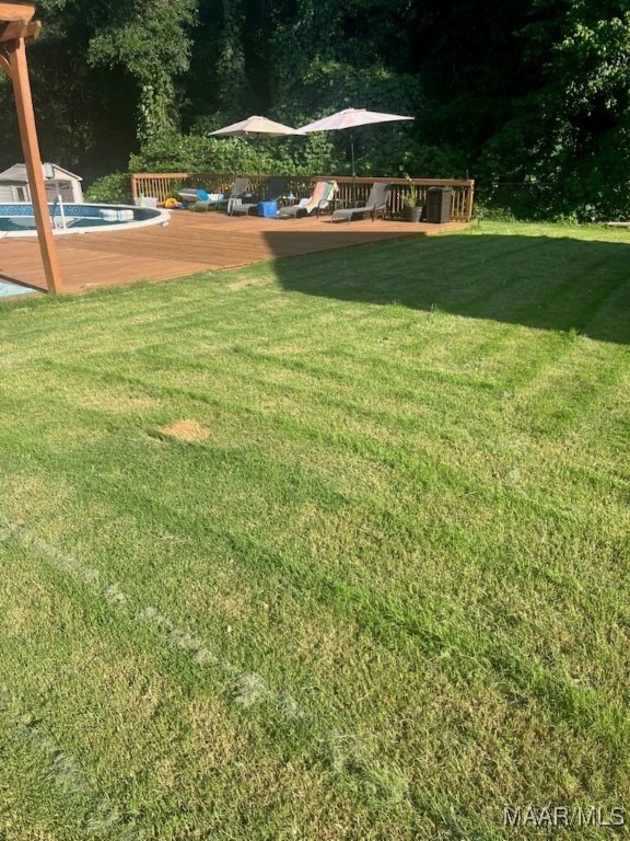 137 Scott Ln, Prattville, AL 36066 - view of green lawn featuring an outdoor pool and a wooden deck