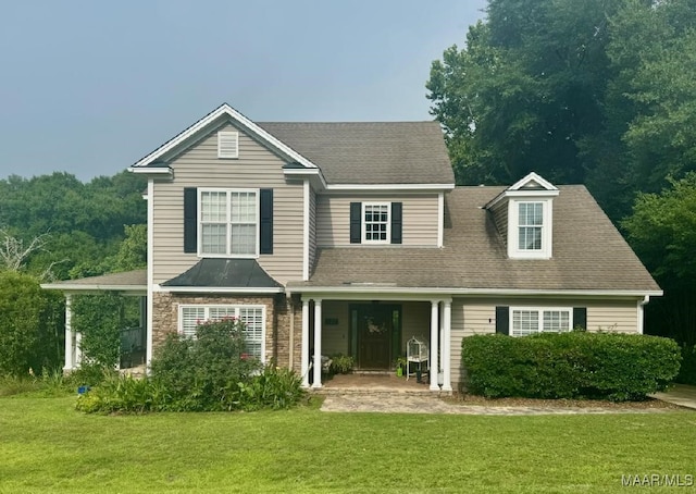 137 Scott Ln, Prattville, AL 36066 - traditional-style home featuring a front lawn, covered porch, and a shingled roof