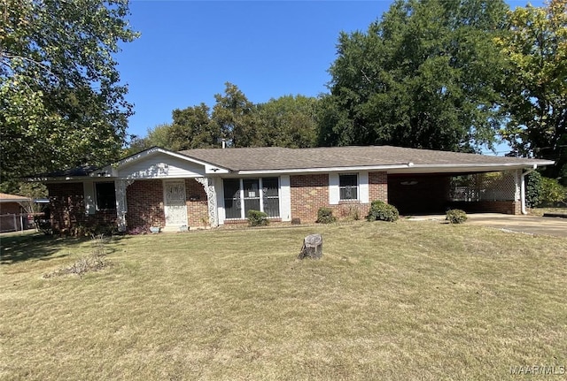 single story home featuring a front lawn and a carport