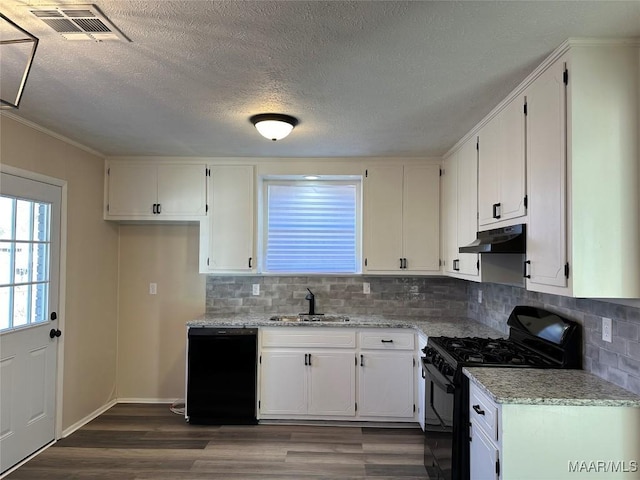 kitchen with sink, black appliances, white cabinets, and light stone countertops